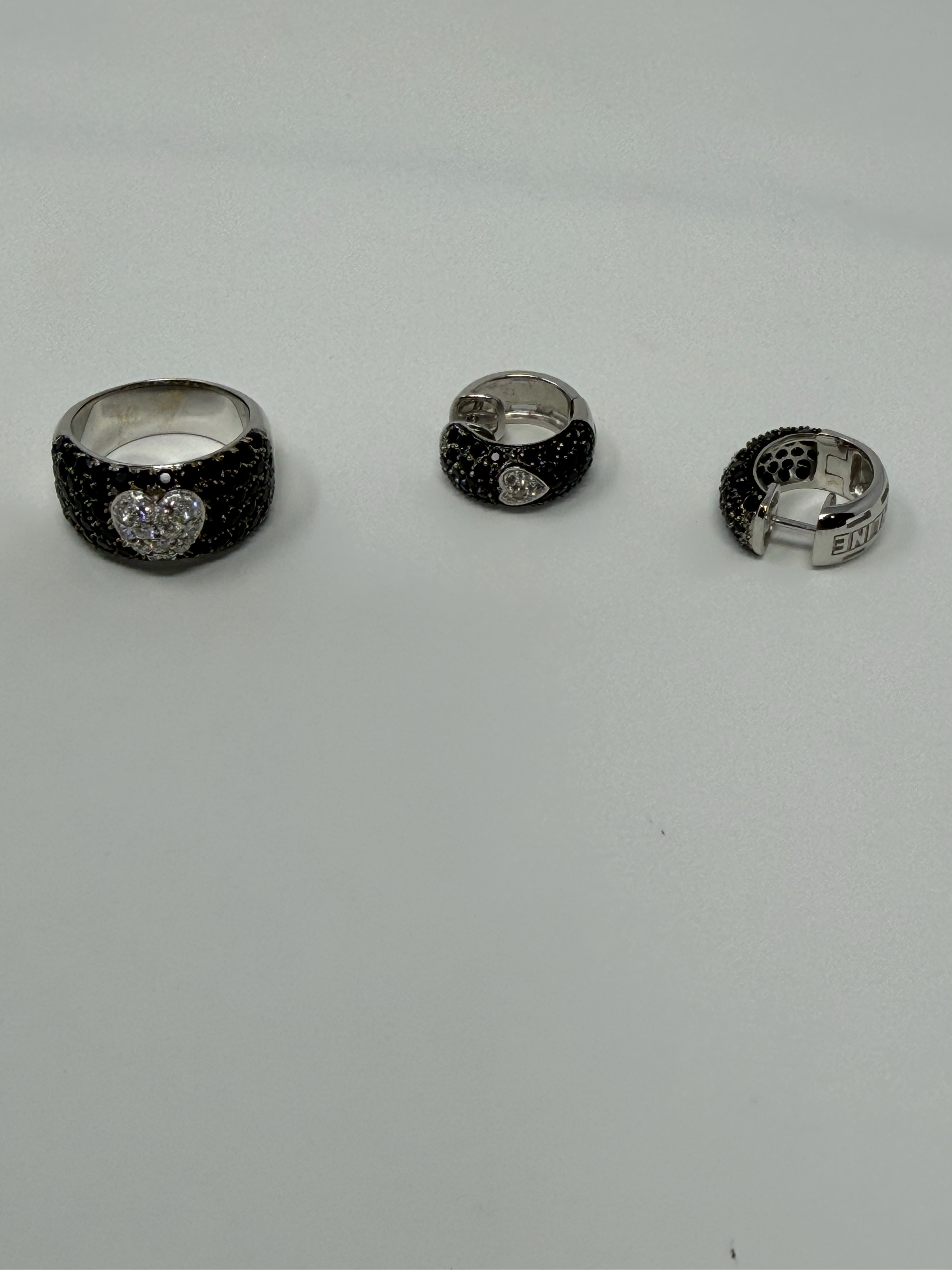 Black diamond pave ring with white diamond heart motif