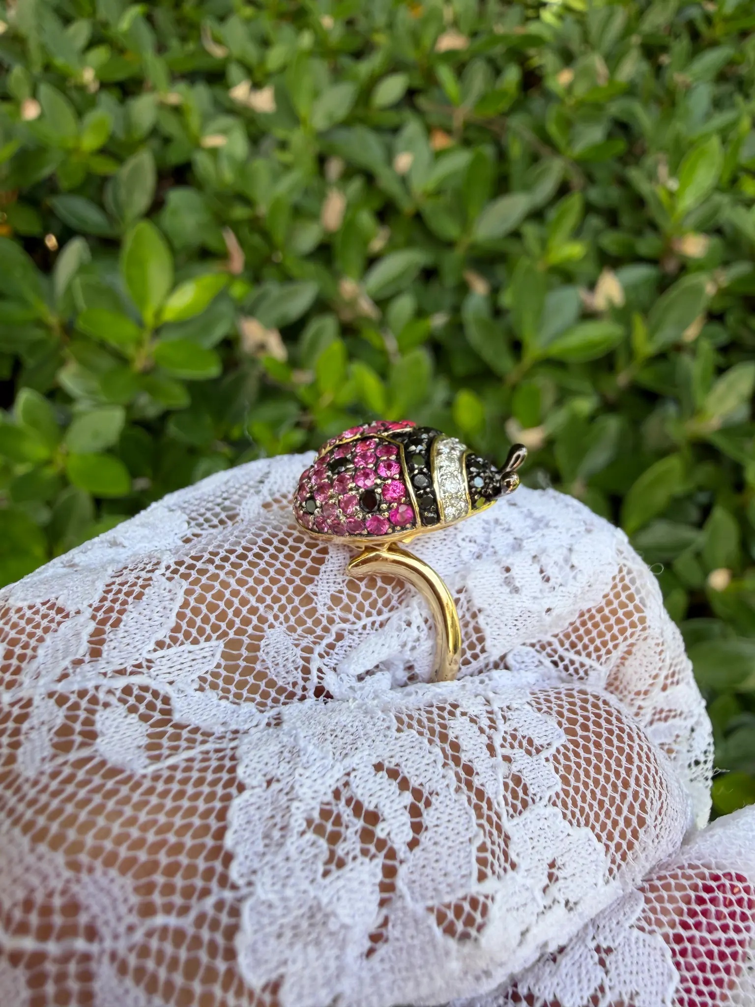 Estate ladybug cocktail ring — side profile showing yellow gold bypass shank