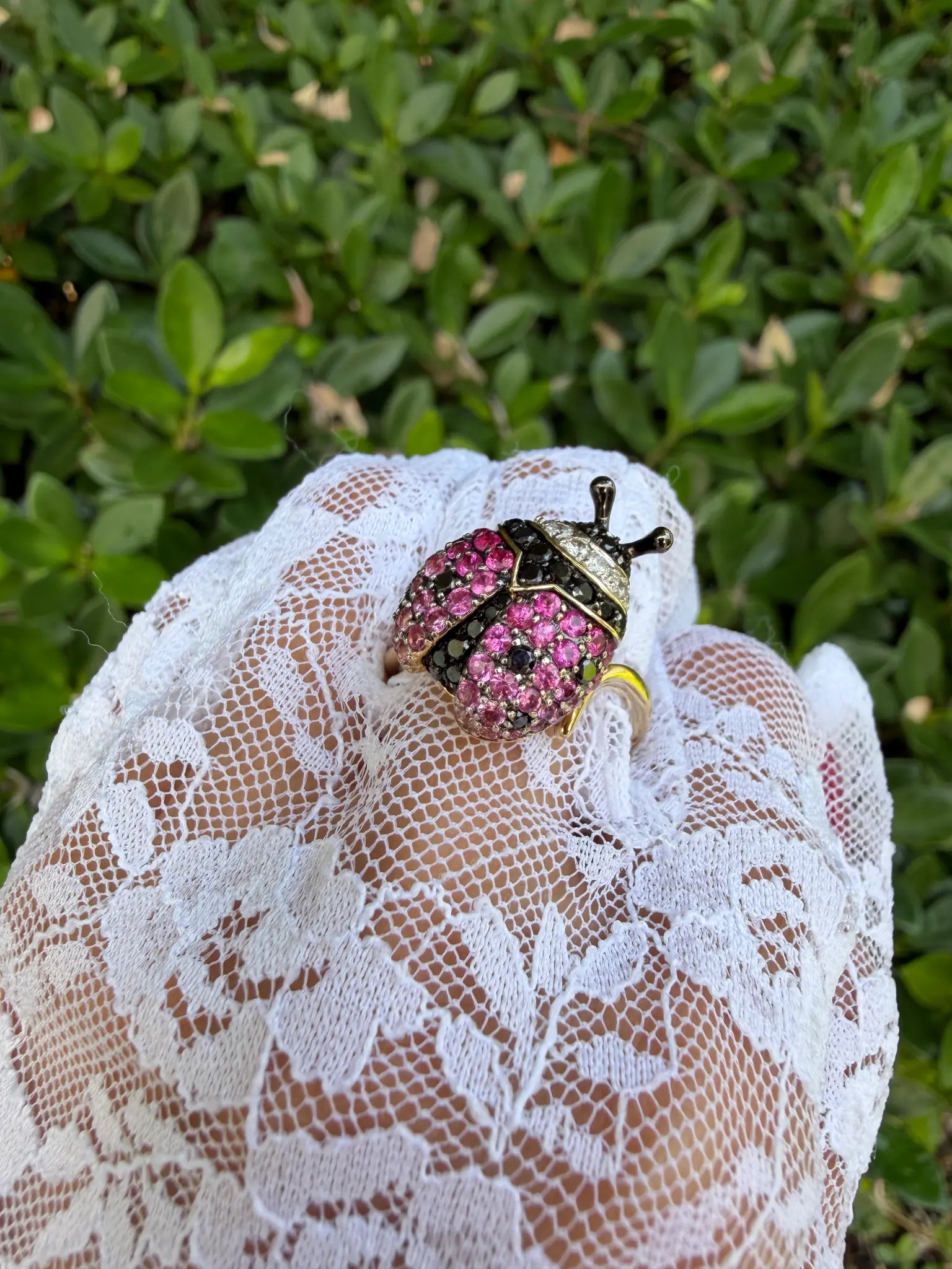 Estate ladybug cocktail ring — top view, pink sapphires and black diamonds